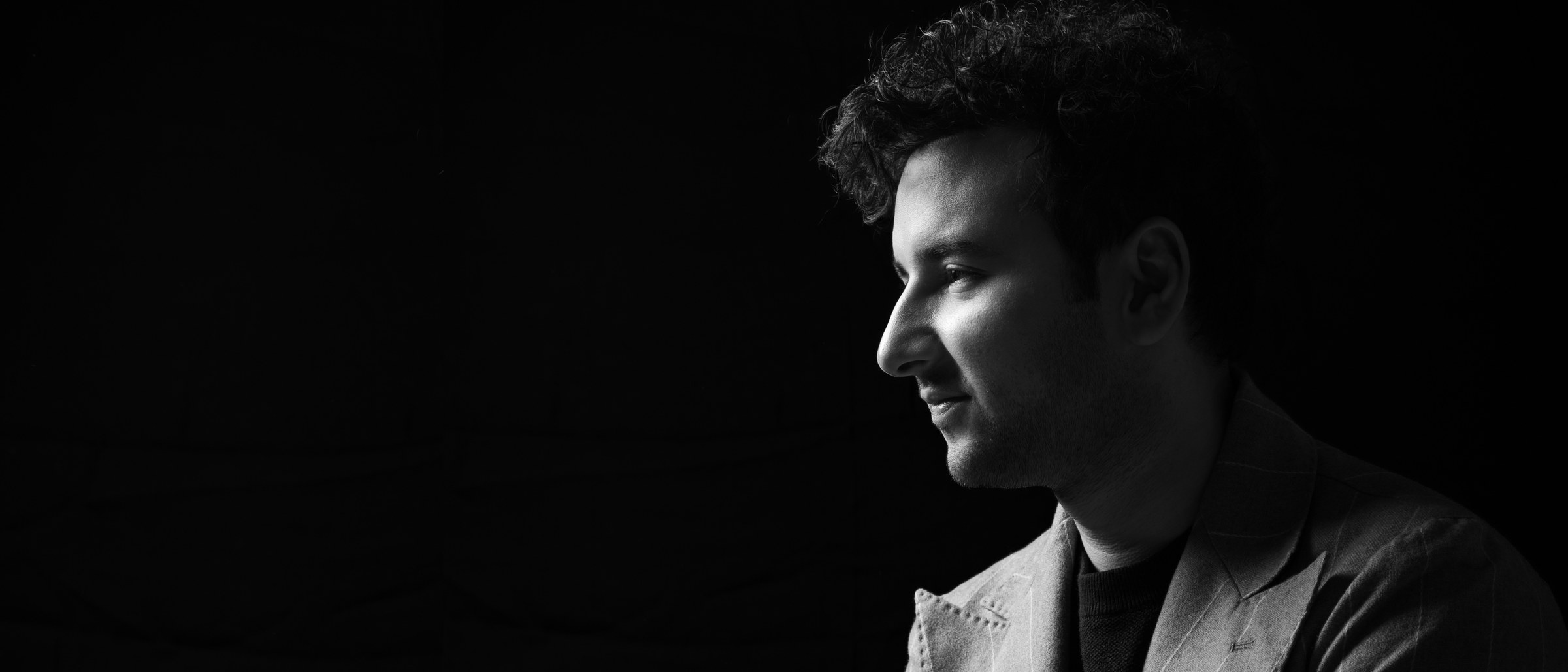 Viraj Bahri, black-and-white studio profile portrait.